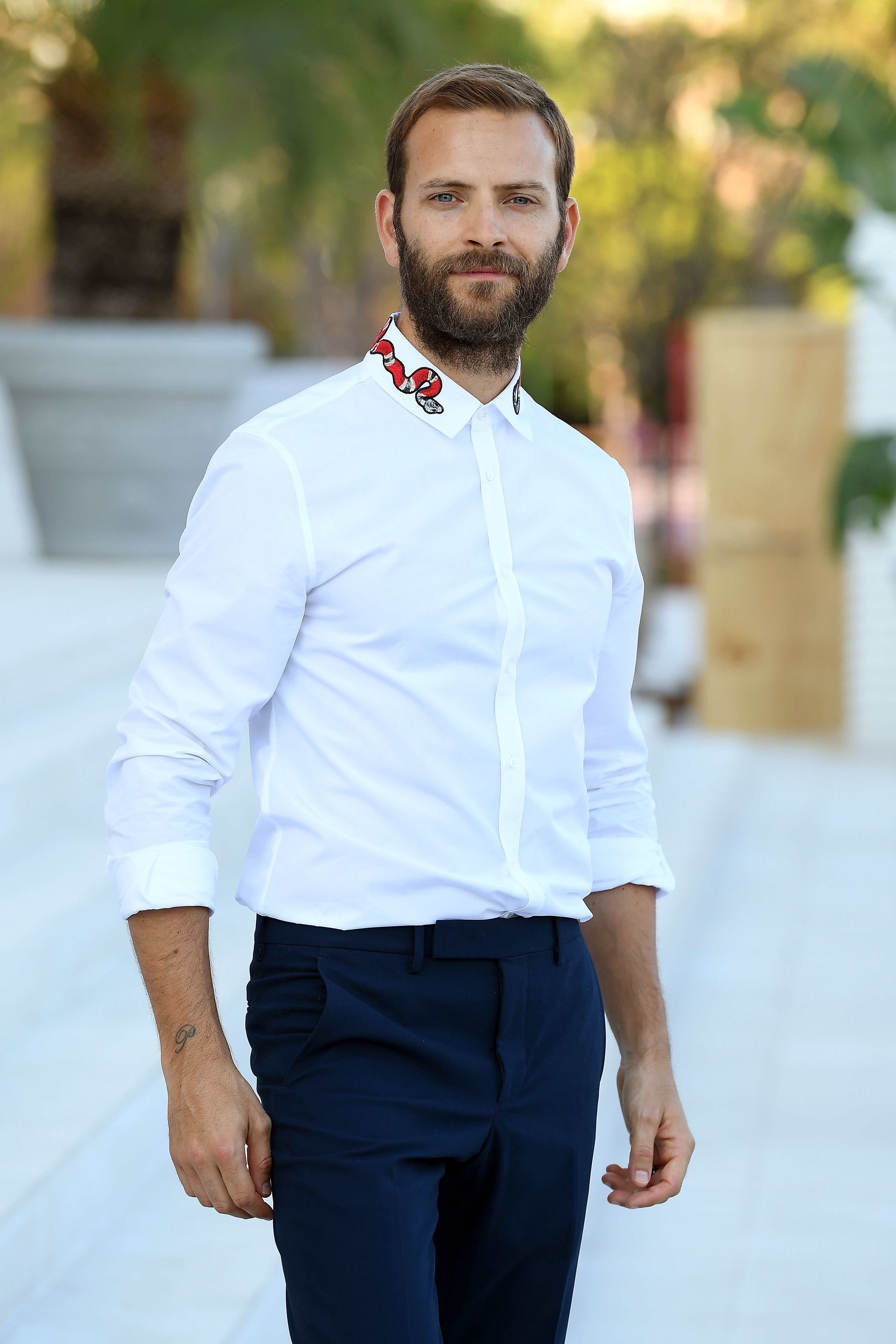 VENICE, ITALY - AUGUST 29: Festival host Alessandro Borghi poses in front of the Palazzo Del Casino during the 74th Venice Film Festival at on August 29, 2017 in Venice, Italy. (Photo by Venturelli/WireImage)